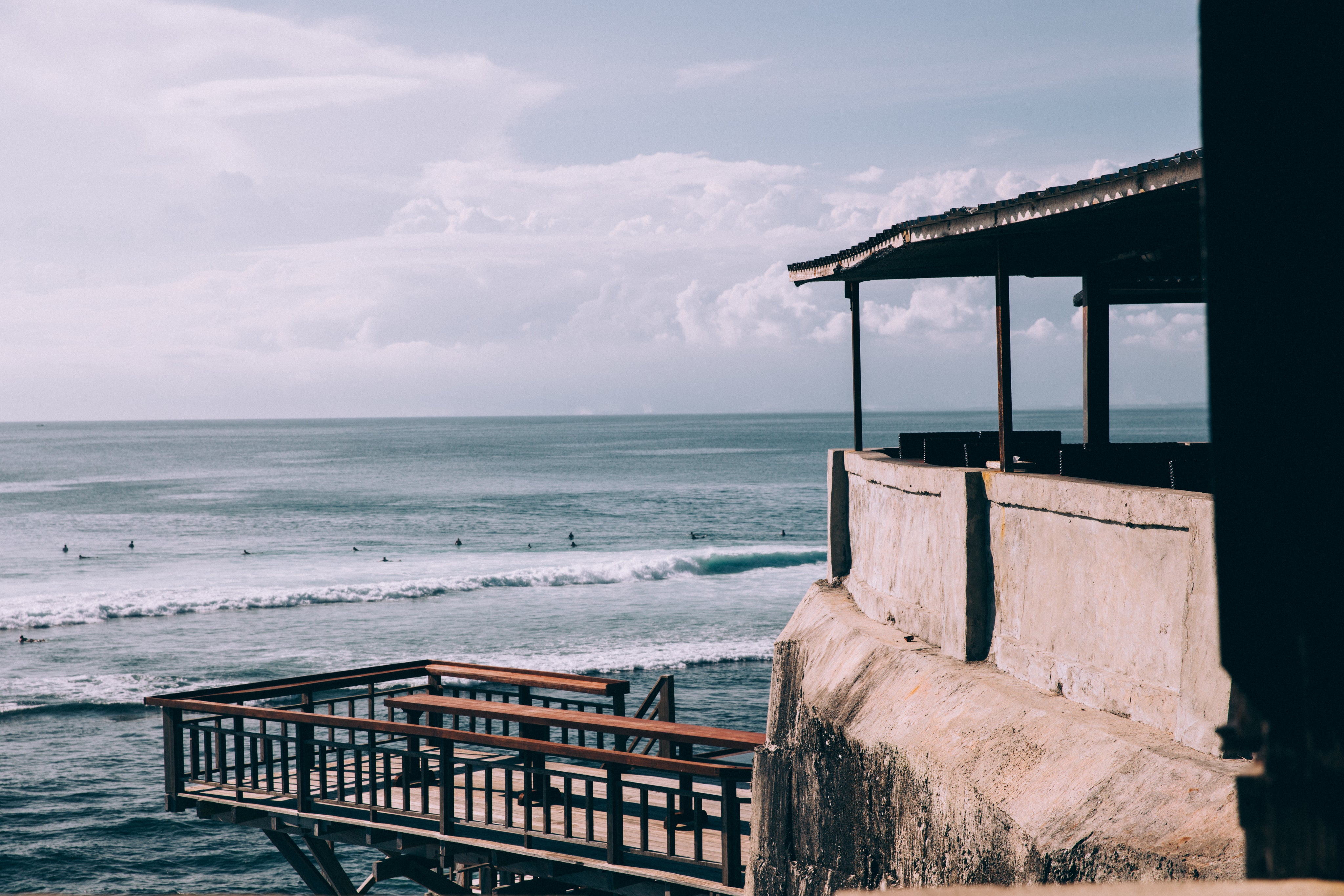 a-thatch-roofed-bar-perched-on-a-rocky-alcove.jpg